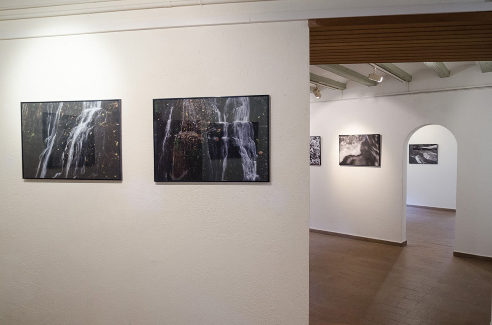 Three gallery rooms in enfilade, with waterfall photographs on each one of them.